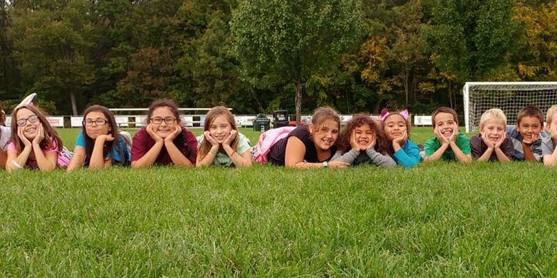header.north.smithfield.kids.smiling.outside.playground